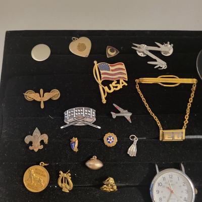 A COLLECTION OF PINS AND MEDALS PLUS WORKING TIMEX WATCH