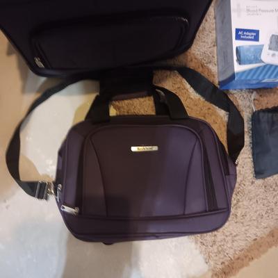 LUGGAGE, EURO OUTLET ADAPTERS, TRAVEL IRON AND BLOOD PRESSURE MONITOR