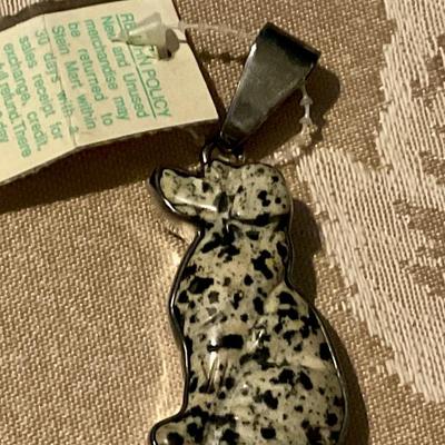 Pendant dog figure wrapped in silver bezel
