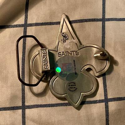 Saints pewter belt buckle has NFL brand sticker