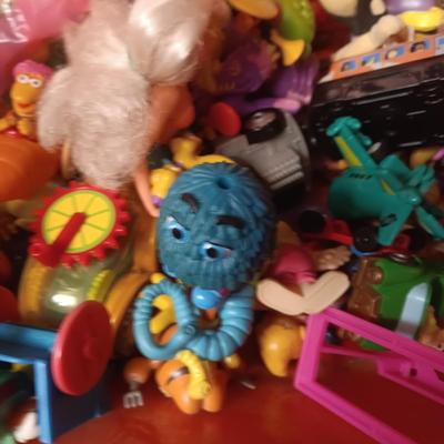 A VARIETY OF MOSTLY MCDONALD'S HAPPY MEAL TOYS