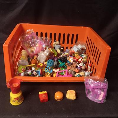 A VARIETY OF MOSTLY MCDONALD'S HAPPY MEAL TOYS