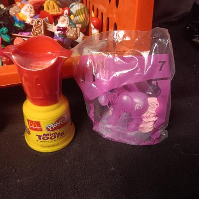 A VARIETY OF MOSTLY MCDONALD'S HAPPY MEAL TOYS