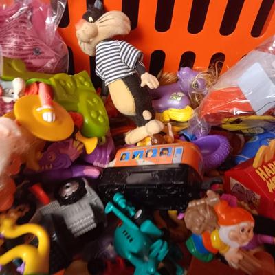 A VARIETY OF MOSTLY MCDONALD'S HAPPY MEAL TOYS