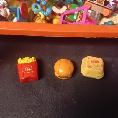 A VARIETY OF MOSTLY MCDONALD'S HAPPY MEAL TOYS
