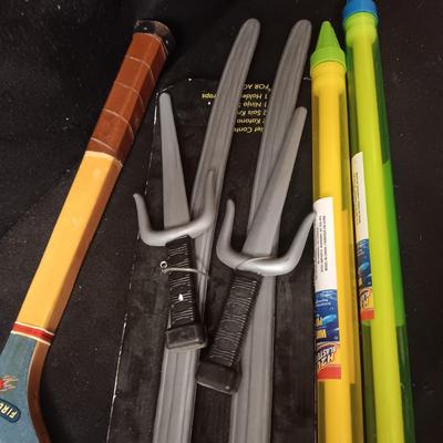 PRETEND SWORDS, WATER SQUIRTERS AND A WOODEN TENNIS RACQUET