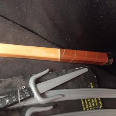 PRETEND SWORDS, WATER SQUIRTERS AND A WOODEN TENNIS RACQUET