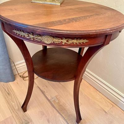 Round Antique Table with brass trim