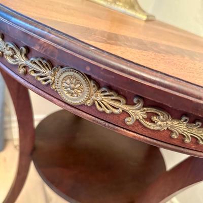Round Antique Table with brass trim