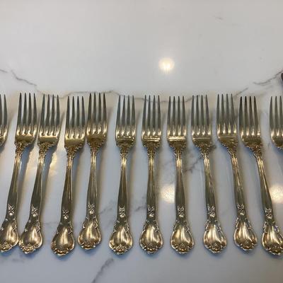 Silver- 10 luncheon knives, 10 cream soup spoon, 12 luncheon forks
