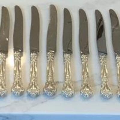 Silver- 10 luncheon knives, 10 cream soup spoon, 12 luncheon forks