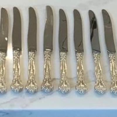 Silver- 10 luncheon knives, 10 cream soup spoon, 12 luncheon forks