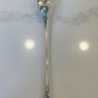 Silver- pierced lettuce fork