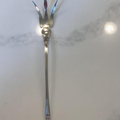Silver- pierced lettuce fork