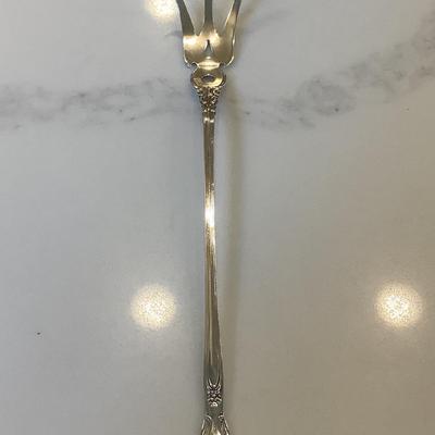 Silver- pierced lettuce fork