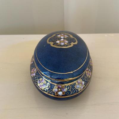Blue and White Porcelain Oval Box with lid featuring Gold Trim and Enameled Floral Motif