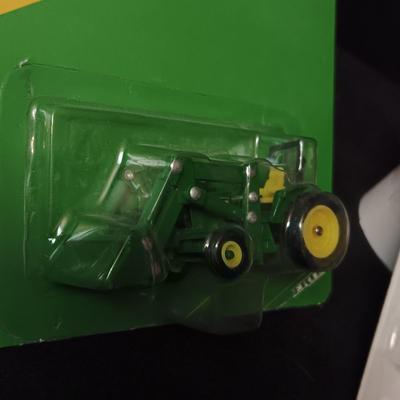 JOHN DEERE 6410 TRACTOR W/LOADER AND A 2ND TRACTOR