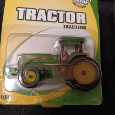 JOHN DEERE TRACTOR AND A SMALL SQUARE BALER