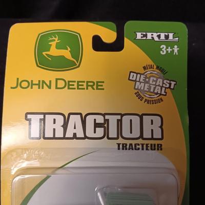 JOHN DEERE TRACTOR AND A SMALL SQUARE BALER