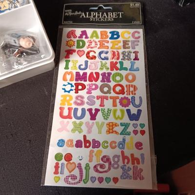 KEYCHAINS IN ORGANIZER BOX, HARMONICA AND STICKERS
