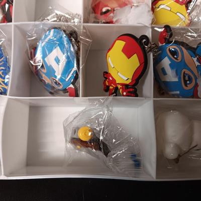 KEYCHAINS IN ORGANIZER BOX, HARMONICA AND STICKERS
