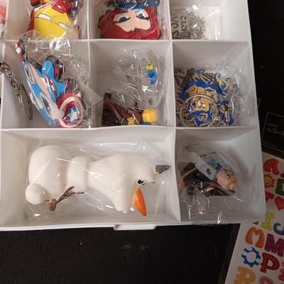 KEYCHAINS IN ORGANIZER BOX, HARMONICA AND STICKERS
