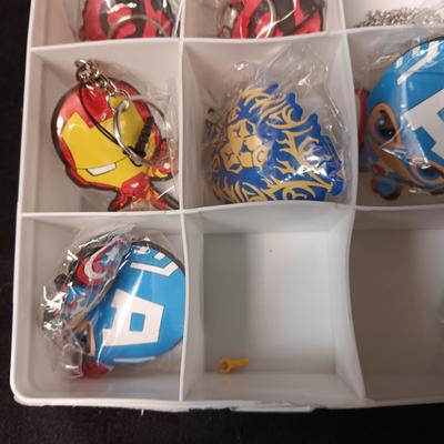 KEYCHAINS IN ORGANIZER BOX, HARMONICA AND STICKERS