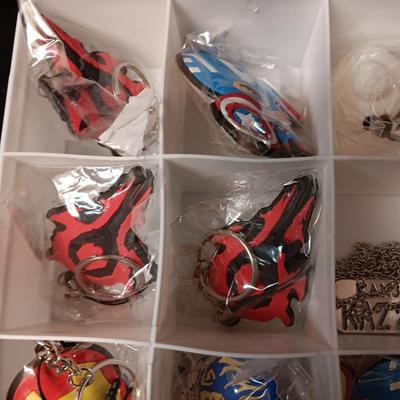 KEYCHAINS IN ORGANIZER BOX, HARMONICA AND STICKERS