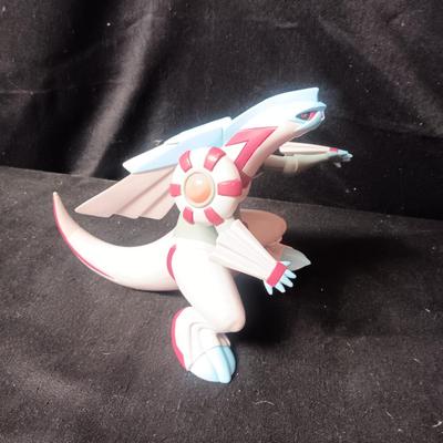 POKEMON TAKARA TOMY FIGURE AND A BARREL OF MONKEYS