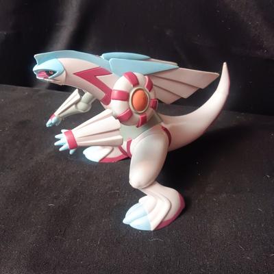 POKEMON TAKARA TOMY FIGURE AND A BARREL OF MONKEYS