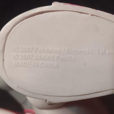 POKEMON TAKARA TOMY FIGURE AND A BARREL OF MONKEYS