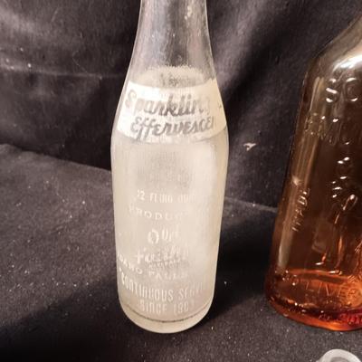 AN ASSORTMENT OF VINTAGE GLASS BOTTLES