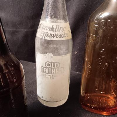 AN ASSORTMENT OF VINTAGE GLASS BOTTLES