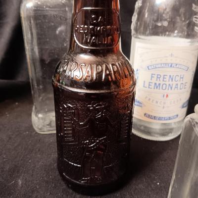 A COLLECTION OF GLASS BOTTLES