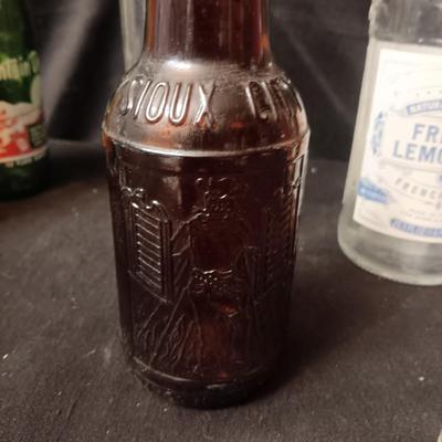 A COLLECTION OF GLASS BOTTLES