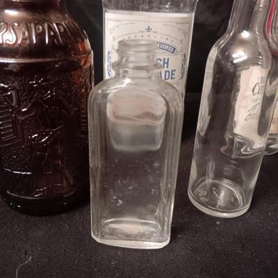 A COLLECTION OF GLASS BOTTLES