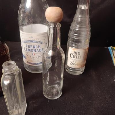 A COLLECTION OF GLASS BOTTLES