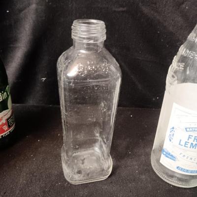 A COLLECTION OF GLASS BOTTLES