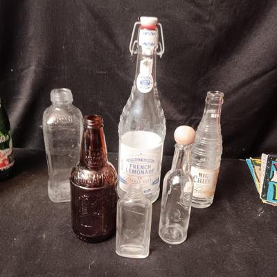A COLLECTION OF GLASS BOTTLES