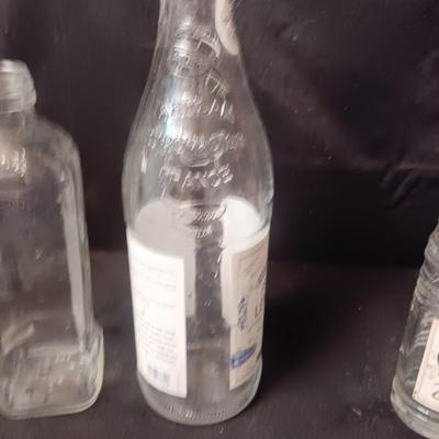 A COLLECTION OF GLASS BOTTLES
