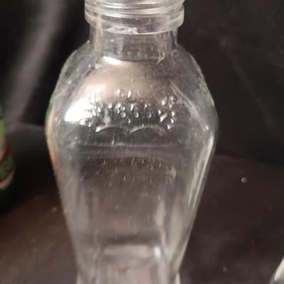 A COLLECTION OF GLASS BOTTLES