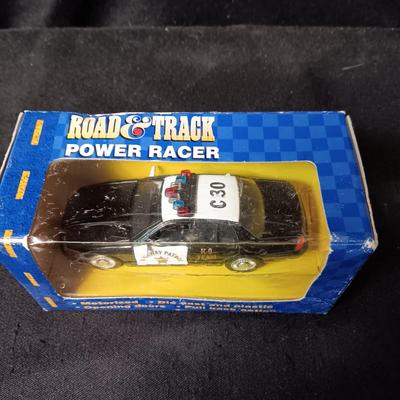 SCALED MODELS OF YAMAHA YZ 125 MOTORCYCLE AND ROAD & TRACK STATE TROOPER CAR