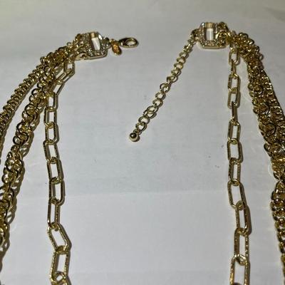 New Never Worn OPC Designer Triple Strand Gold-tone Necklace w/Rhinestone clasp Area in Very Good Condition as Pictured. (Jewelry #60).