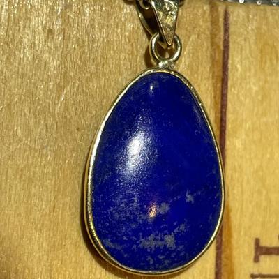 VINTAGE Dainty 14K Yellow Gold Lapis Pendant on a 16" Fashion White Metal Necklace in Very Good Preowned Condition as Pictured.