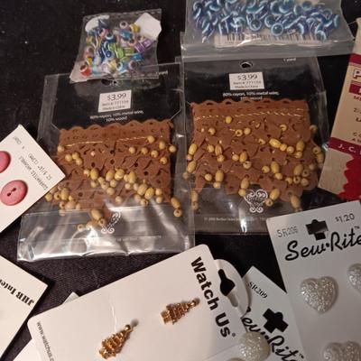 BUTTONS, BEADS, SNAPS AND EDGING