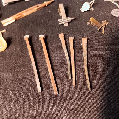 TIE TACKS AND CLIPS, SQUARE NAILS, BUSH CO RODEO TOKEN, CUFFLINKS AND SMALL PADLOCKS