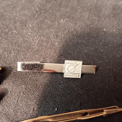 TIE TACKS AND CLIPS, SQUARE NAILS, BUSH CO RODEO TOKEN, CUFFLINKS AND SMALL PADLOCKS