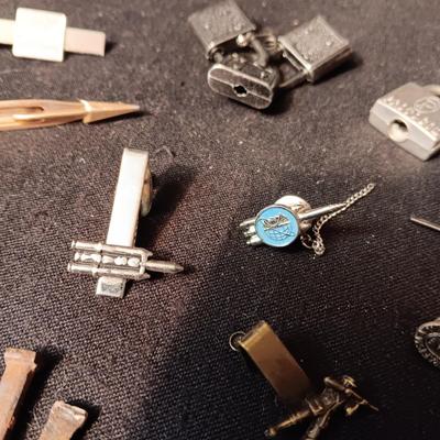 TIE TACKS AND CLIPS, SQUARE NAILS, BUSH CO RODEO TOKEN, CUFFLINKS AND SMALL PADLOCKS