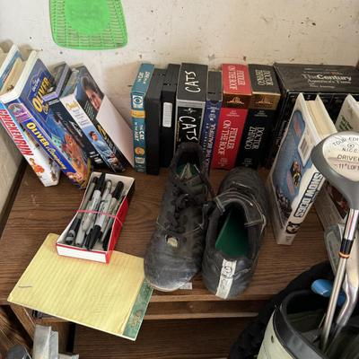 Golfing equipment, movies, and Shelf
