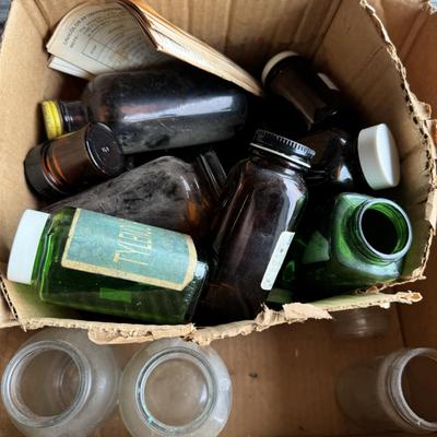 Totes and old glass medicine bottles